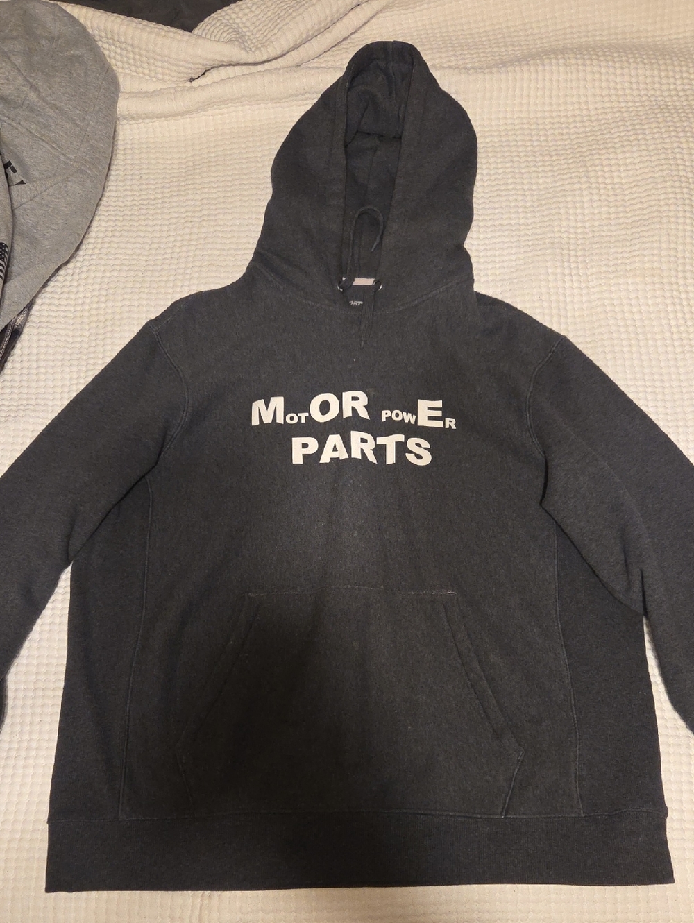 Sport-Tek charcoal gray hooded sweatshirt with white text